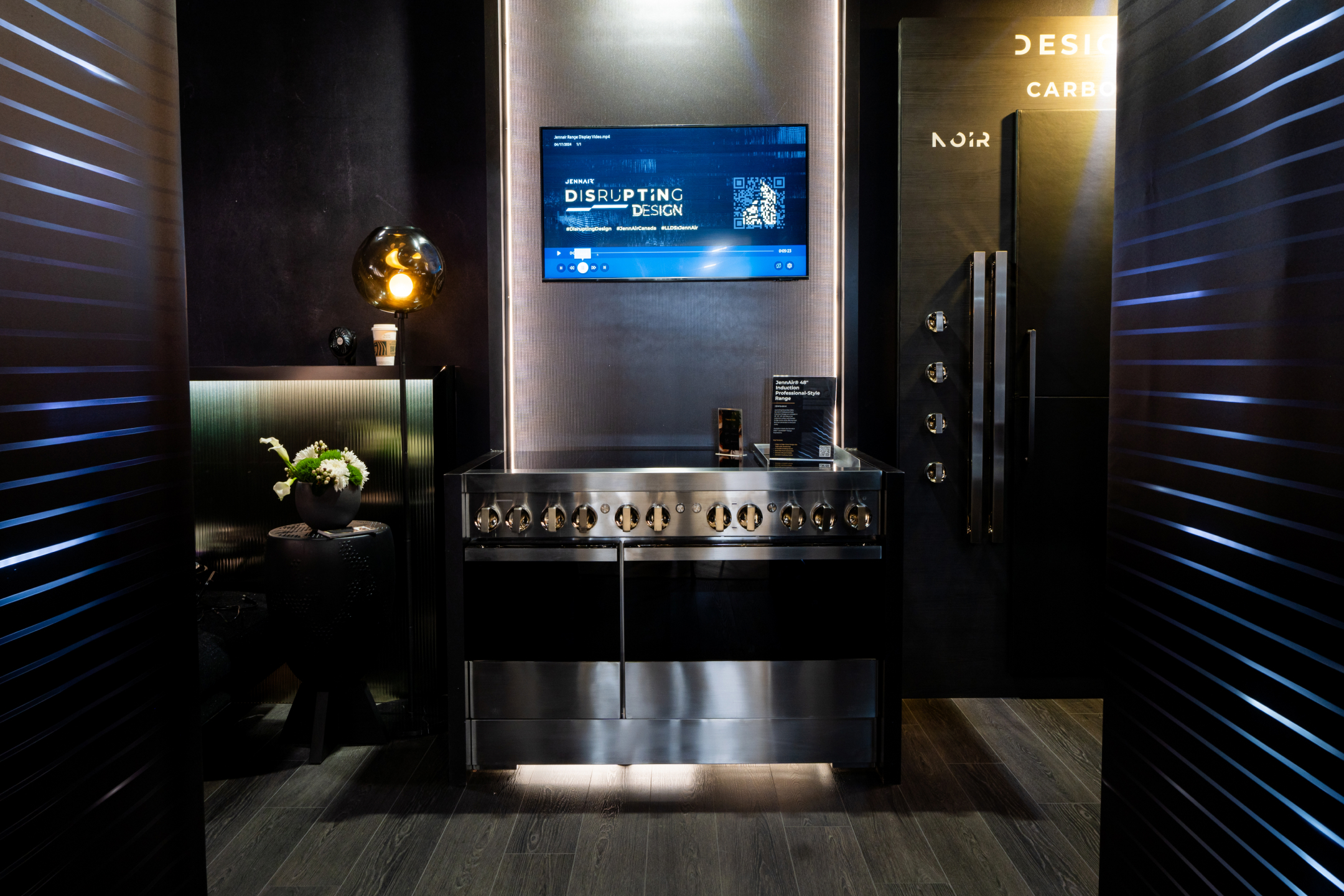 Contemporary kitchen with stainless steel appliances, grey cabinets, and white countertops.